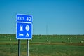 Exit Sign and Hay Bales in a Farm Field Royalty Free Stock Photo