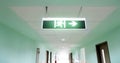 Exit sign suspended from the ceiling of hospital Royalty Free Stock Photo