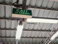 Exit sign with thai word means exit under old factory roof