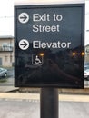 Exit sign to street and elevator