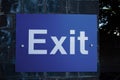 Exit sign in white lettering on blue