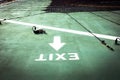 An Exit text and arrow on helideck