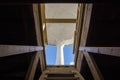 Exit to a roof on a wooden ladder in sunny day