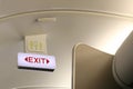 Exit and toilet sign on board airplane