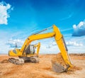 Exkavator on construction site and sky background Royalty Free Stock Photo