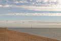 Exmouth, devon: low tide, beach and walkers. Cloudscape horizon