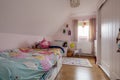 Modern childs bedroom with brightly coloured duvet