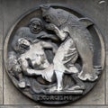 Exorcism. Stone relief at the building of the Faculte de Medicine Paris