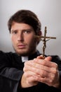 Exorcist with crucifix Royalty Free Stock Photo