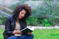 Exotic beautiful young girl relaxing in the garden Royalty Free Stock Photo