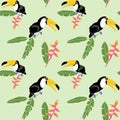 Exotic bird with big nib toucan and tropical leaves and flowers heliconia seamless pattern. Summer colorful background for textile Royalty Free Stock Photo