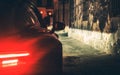 Exotic Car Night Drive in Dark Aged Urban Area Alley