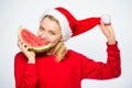 Exotic christmas concept. Christmas girl eat watermelon. Exotic winter holiday. Celebrate new year summer. Girl wear