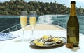 Exotic country voyage. Champagne bottle and flutes glasses on deck of luxury cruise ship during honeymoon holidays. Love