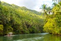 Exotic cruise boat with tourists on a jungle river Loboc, Bohol Royalty Free Stock Photo