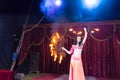 Exotic Fire Dancer Twirling Flaming Batons Royalty Free Stock Photo