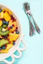 Exotic fresh fruit salad in rustic bowl Royalty Free Stock Photo