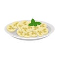 Exotic fruit banana, sliced into circles, on plate with mint leaves.