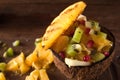 Exotic fruit salad mixed in coconut shell Royalty Free Stock Photo
