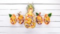 Exotic fruit salad served in half a pineapple. Papaya, Dragon Fruit, tamarind, cactus fruit, mango, mangosteen Royalty Free Stock Photo