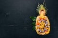 Exotic fruit salad served in half a pineapple. Papaya, Dragon Fruit, tamarind, cactus fruit, mango, mangosteen Royalty Free Stock Photo