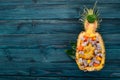 Exotic fruit salad served in half a pineapple. Papaya, Dragon Fruit, tamarind, cactus fruit, mango, mangosteen Royalty Free Stock Photo