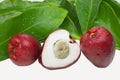 Exotic fruit Syzygium malaccense with leaves and one cut in white background