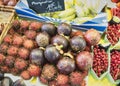 Exotic fruits. Market stall with variety of organic fruits. Colorful fruits in the marketplace. Bright summer background. Healthy