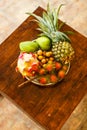 Exotic fruits on plate: mango, dragon fruit; mango; pineapple an Royalty Free Stock Photo