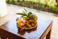 Exotic fruits on plate: mango, dragon fruit; mango; pineapple an Royalty Free Stock Photo