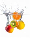 Exotic fruits splash in clear water isolated on white