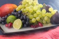 Exotic fruits variety still life with grapes, figs, lime, peach, mango and watermelon Royalty Free Stock Photo