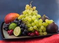 Exotic fruits variety still life with grapes, figs, lime, peach, mango and watermelon Royalty Free Stock Photo