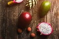 Exotic fruits on wooden background. Fresh dragon fruit, avocado, pineapple, lychee, mango at table. Fruit diet concept. Healthy Royalty Free Stock Photo