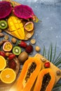 Exotic fruits on wooden chopping board