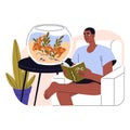 Exotic goldfishes swim in water. Pet animals owner rests, looking on golden fishes in aquarium. Young man sits in