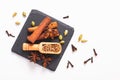 Exotic herbal Food concept Mix of the organic Spices cinnamon stick, cardamom pods, star anise and coriander seeds on a black Royalty Free Stock Photo