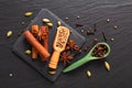 Exotic herbal Food concept Mix of the organic Spices cinnamon stick, cardamom pods, star anise and coriander seeds on a black Royalty Free Stock Photo