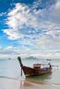 Exotic island and long tailboat Royalty Free Stock Photo