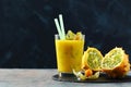 Exotic juice fruit or smoothie in glass on dark Royalty Free Stock Photo