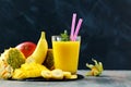 Exotic juice fruit or smoothie in glass on dark Royalty Free Stock Photo