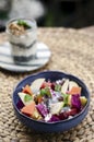 Exotic mixed tropical asian fruit salad in bowl outdoors