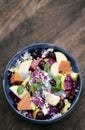 Exotic mixed tropical asian fruit salad in bowl outdoors