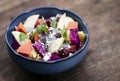 Exotic mixed tropical asian fruit salad in bowl outdoors