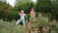 Prickly pear cacti and young cowboy with his girlfriend Royalty Free Stock Photo