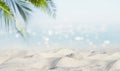 Exotic sandy beach with blurred summer sea on the background