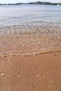 Exotic sandy beach, tropical blue mediterranean sea with waves and sea foam. Beautiful natural environment, panorama, landscape. Royalty Free Stock Photo