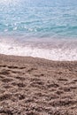 Exotic sandy beach, tropical blue mediterranean sea with waves and sea foam. Beautiful natural environment, panorama, landscape. Royalty Free Stock Photo