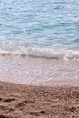 Exotic sandy beach, tropical blue mediterranean sea with waves and sea foam. Beautiful natural environment, panorama, landscape. Royalty Free Stock Photo