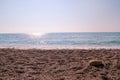 Exotic sandy beach, tropical blue mediterranean sea with waves and sea foam. Beautiful natural environment, panorama, landscape. Royalty Free Stock Photo